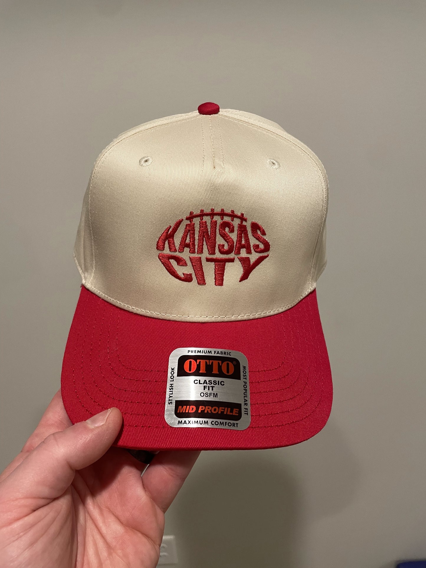 kansas city text in the shape of a football hat
